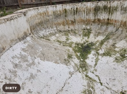 Worn, stained pool plaster before resurfacing